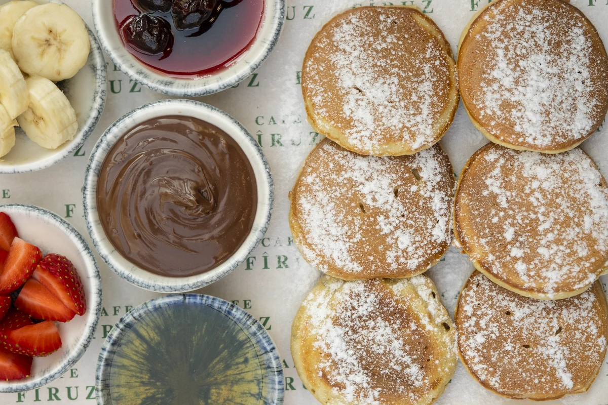 Pancakes with powdered sugar, Nutella and jam